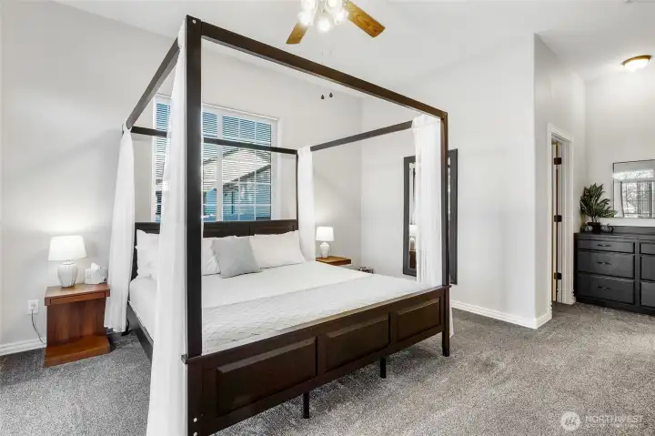 2nd Primary en suite on the main floor with huge walk in closet and a view of the lake. Access to the patio from the slider in the bedroom.