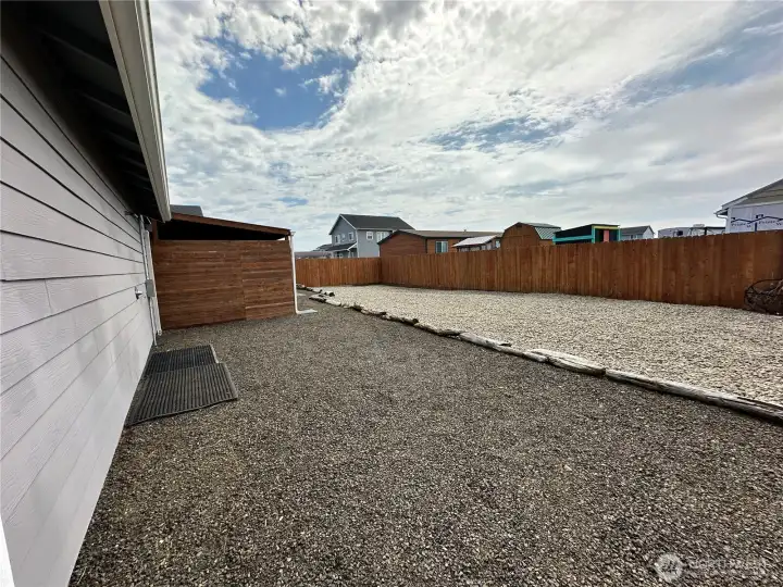 Large fenced landscaped back yard