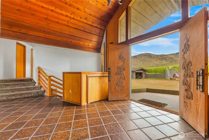 Enter through beautifully etched double front doors open to inviting and minimalist styled home entryway