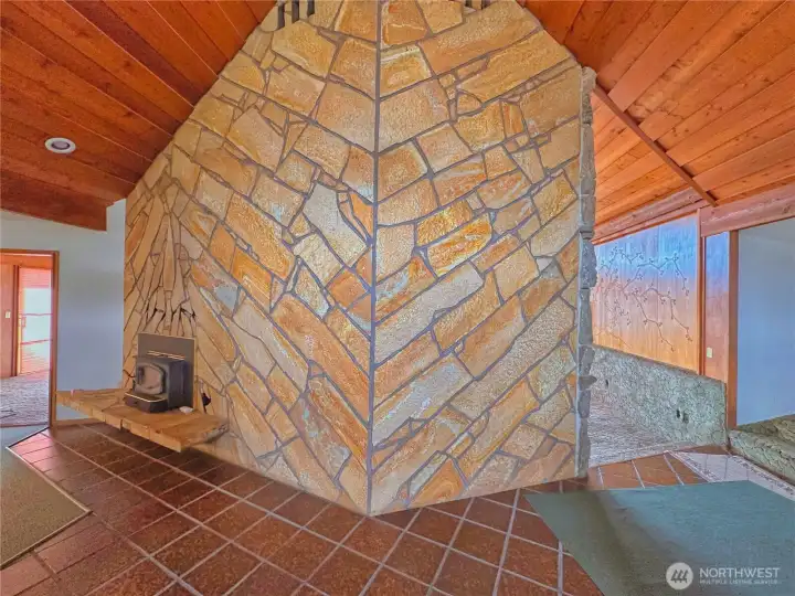 Entryway with floor-to-ceiling double fireplace