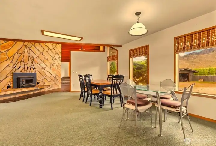 Large kitchen dining space with fireplace insert is perfect for gatherings