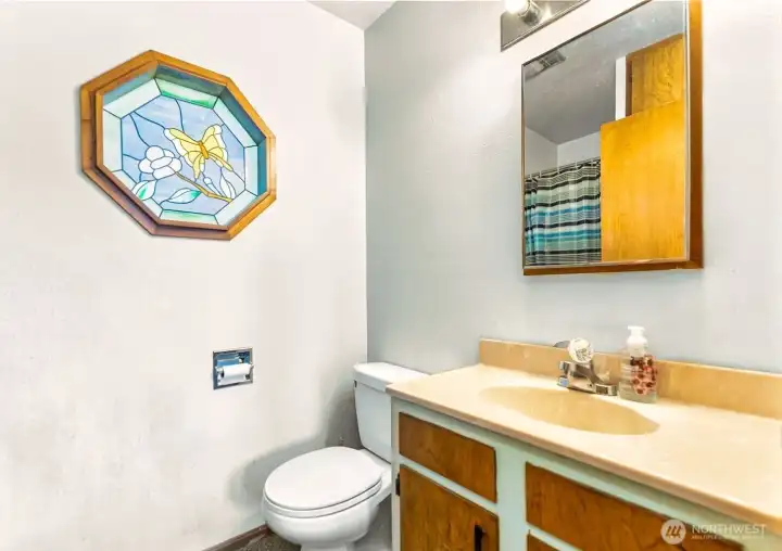 Half guest bathroom off kitchen dining area