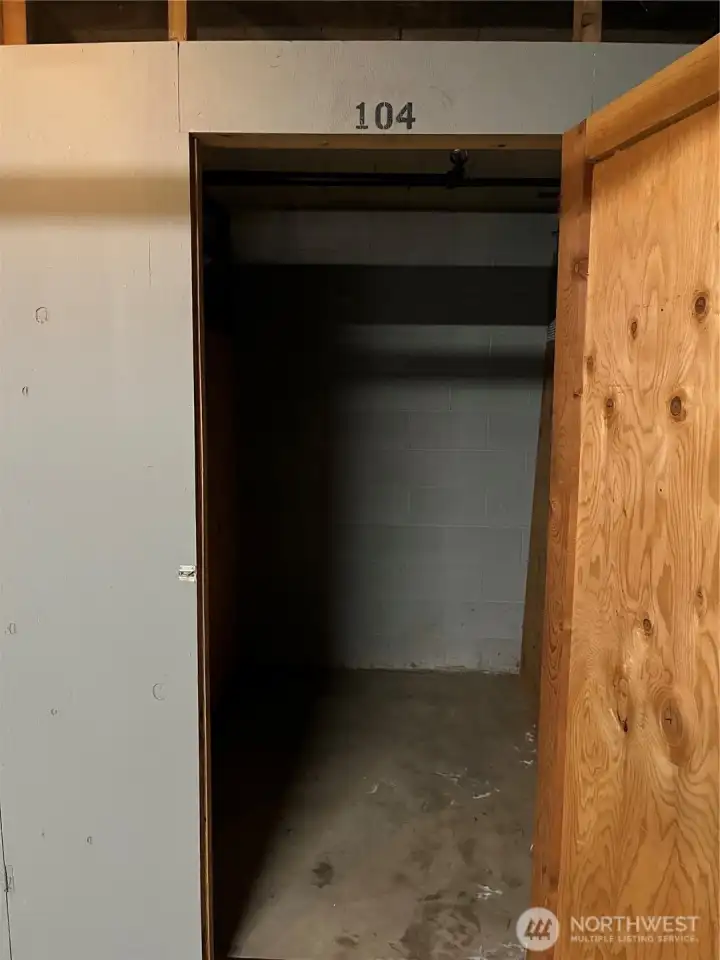 Storage unit in Garage.  Take elevator down to basement level