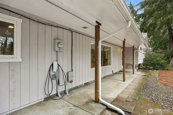 Welcoming covered front porch. Tesla EV charger (Electric Vehicle Charger). Wired for generator.