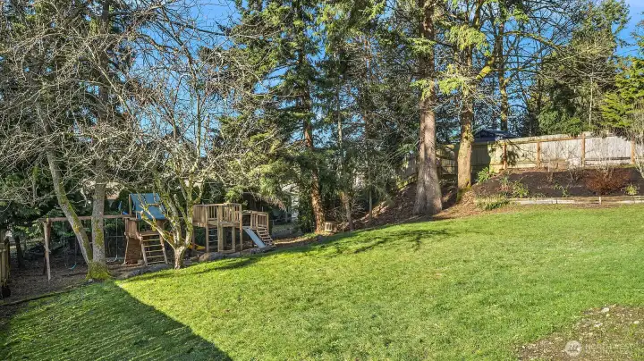 Park-like backyard with garden beds is ready for play!