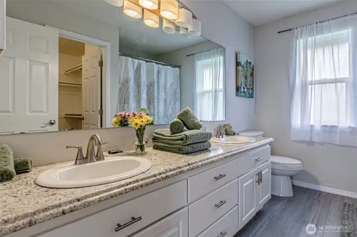 Full en suite bathroom with double vanity