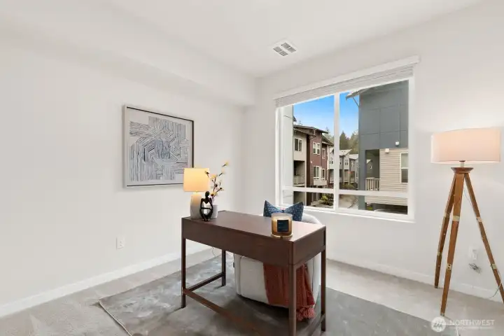 Main level bedroom is great flex space and offers walk in closet!