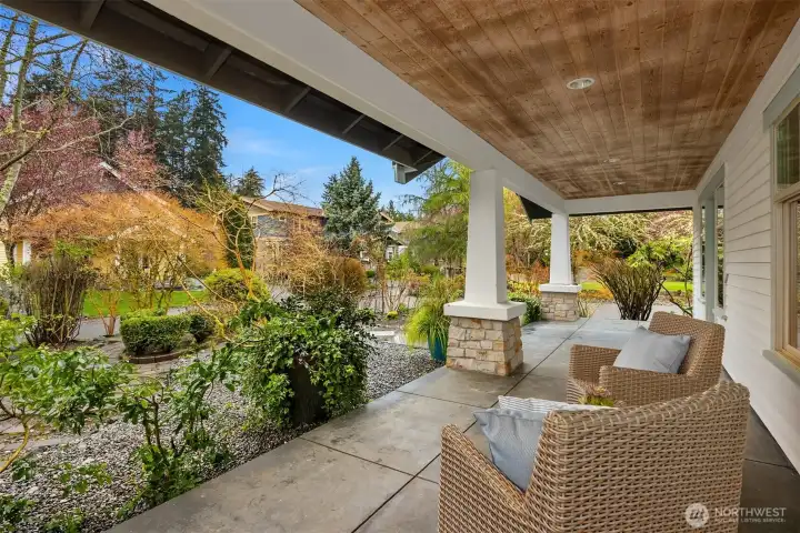 The beautiful covered porch lets you enjoy the space well beyond the typical season.