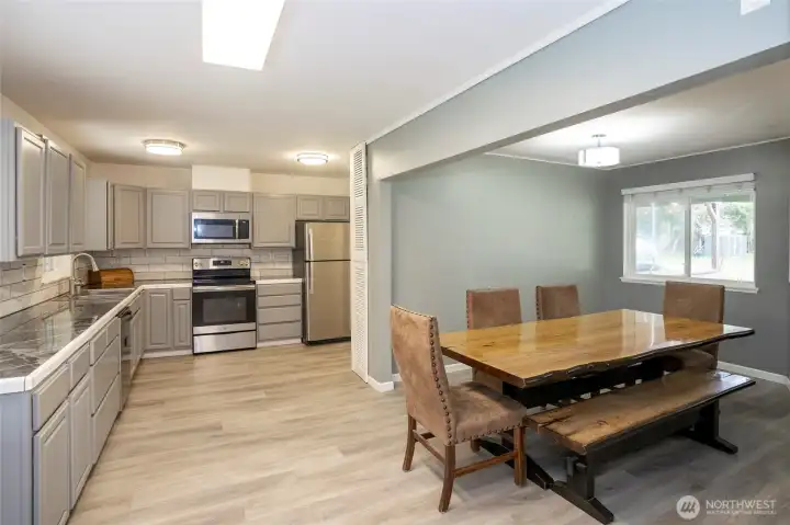 Spacious dining room conveniently located off the kitchen, seamlessly connecting to the living room to keep you engaged with the rest of the home.