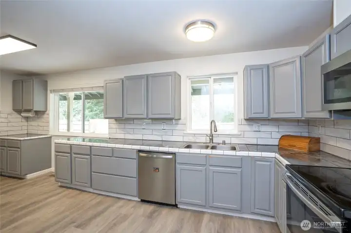 Well-appointed kitchen featuring abundant cabinetry to accommodate all your storage needs.