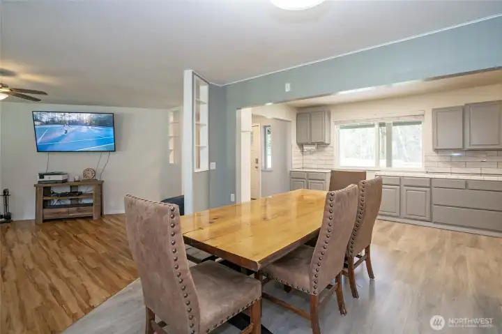 Dining area adjacent to the kitchen with a step-down leading into the living area, creating a comfortable and connected layout.