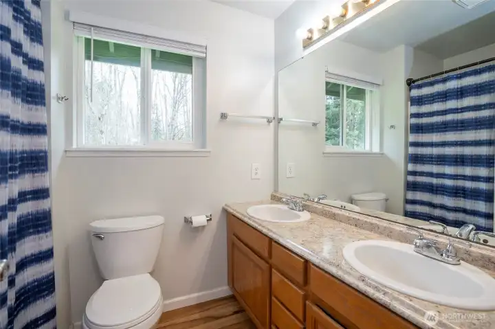 Primary ensuite offering dual sinks and a spacious, well-designed layout for everyday comfort and functionality.