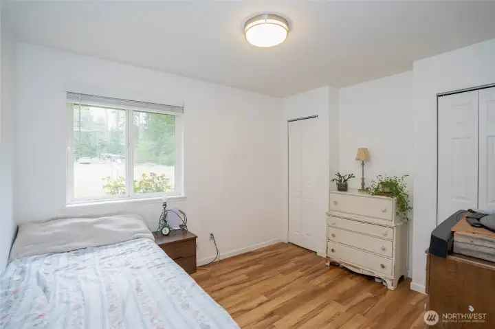 Guest suite #1 is bright and inviting, featuring double closets for added storage.