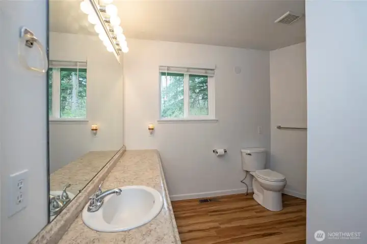 Full guest bath featuring an extra-large vanity with ample counter space.