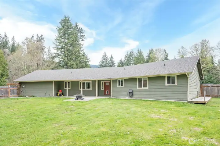 Front exterior of the home featuring a covered patio that enhances curb appeal and provides a welcoming outdoor living space.
