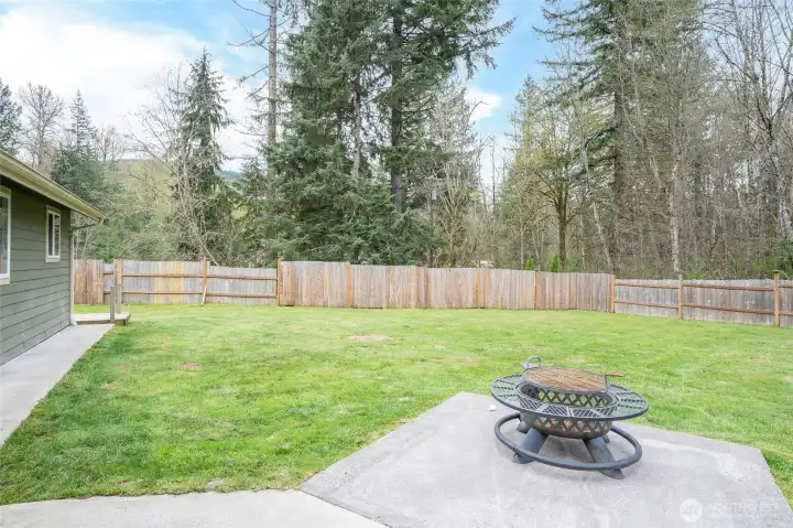 Second patio area located just off the front entry, providing an additional space for outdoor entertaining.