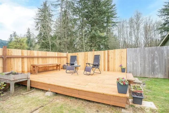 Nice deck area located to the left of the home, offering a perfect additional space to relax and unwind.