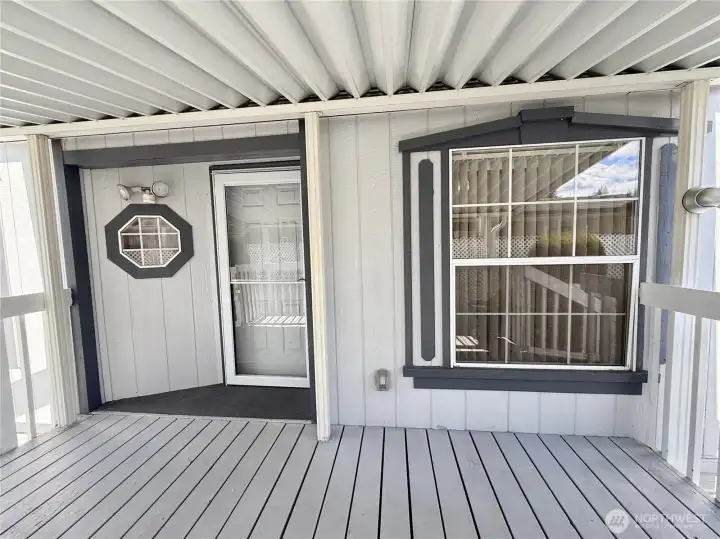 Covered front porch with enough room to entertain.