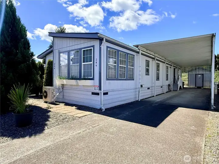 Back out front, showing the huge carport that can fit 3 cars.