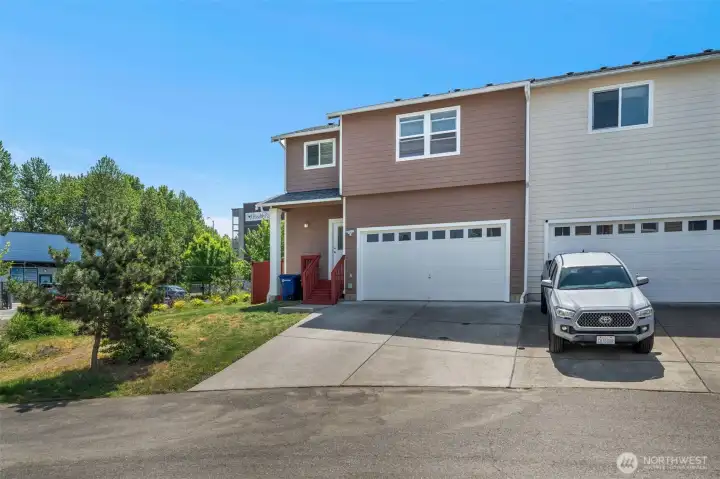 The back of the home with a good size 2 car grage.