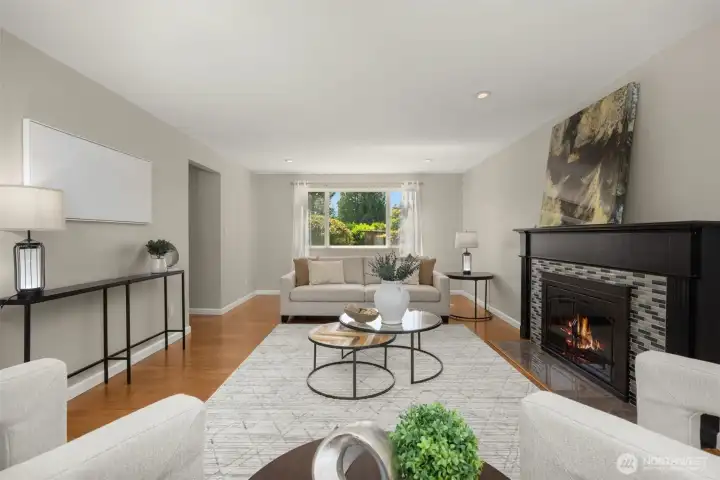 Oversized living room with gorgeous backyard view and warm fireplace