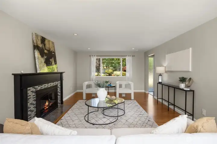 Oversized living room with gorgeous backyard view and warm fireplace