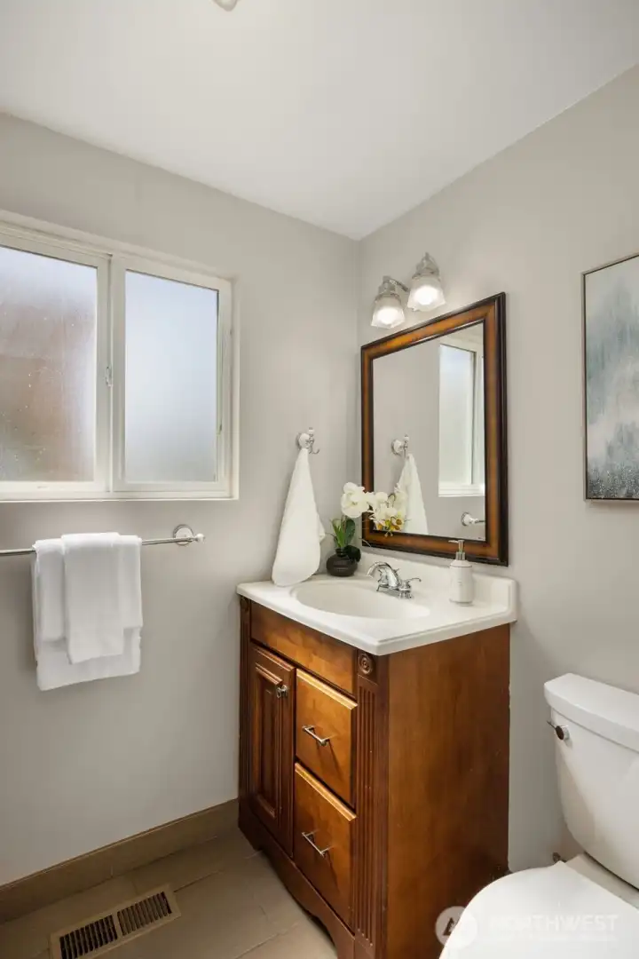 Half bathroom on the mainfloor. Don't miss the additional closet behind the door.