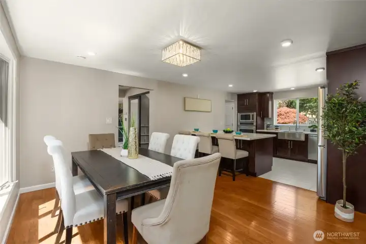 Formal Dining room with the view of the gorgeous backyard through bay window