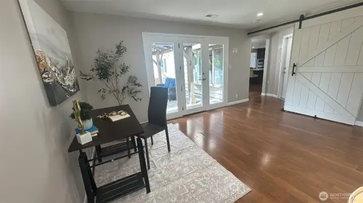 Grand size family room with gorgeous view of the backyard and a home office setup