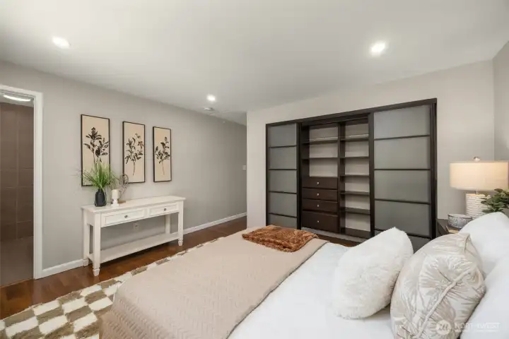 Gorgeous master bedroom with attached bathroom and closets with custom cabinets