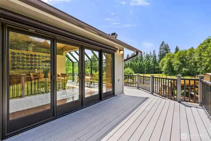 Large sliding doors that open to the spacious composite deck with territorial, garden, and river views. Large sliding doors that open to the spacious composite deck with territorial, garden, and river views.