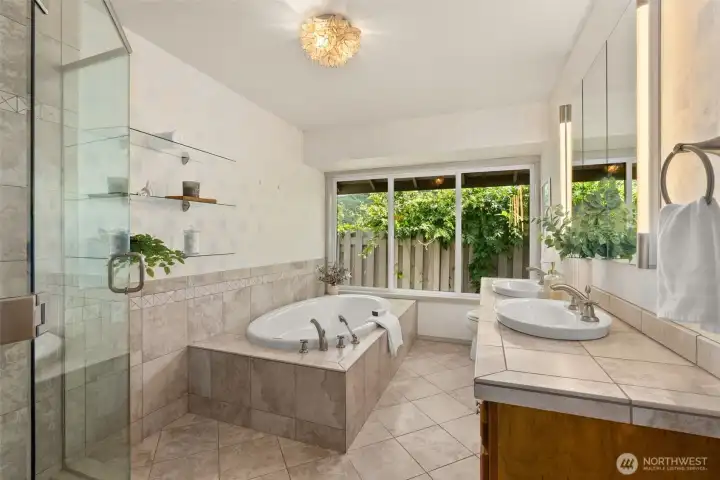 Primary bath with soaking tub, walk in shower, and double vanity. Primary bath with soaking tub, walk in shower, and double vanity.