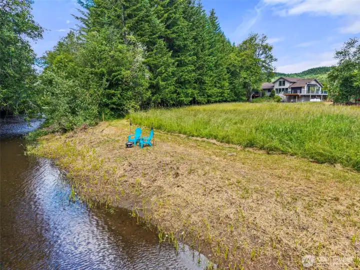 River with Beach and view of rear of home. River with Beach and view of rear of home.