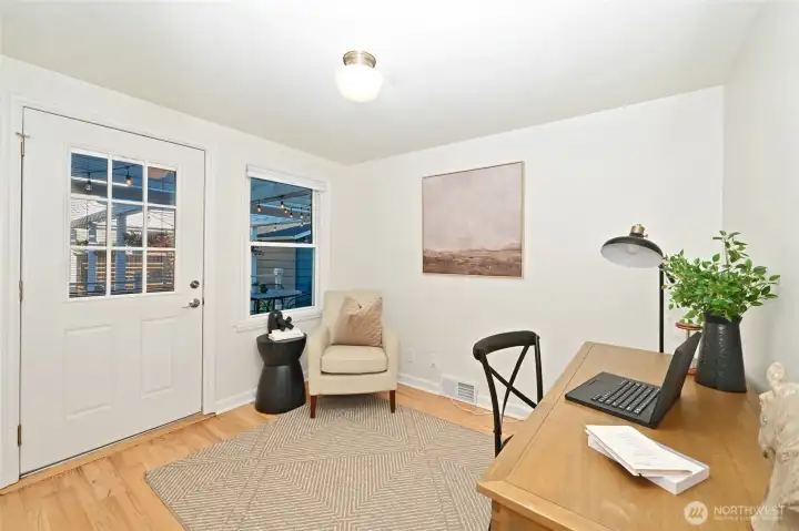 Main floor office has door to back grounds and can flex into bedroom.