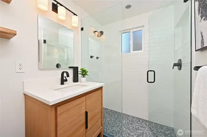 Newer bath on main floor has designer tile.