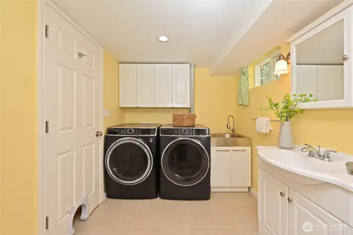 Laundry with new sink and 3/4 bath.