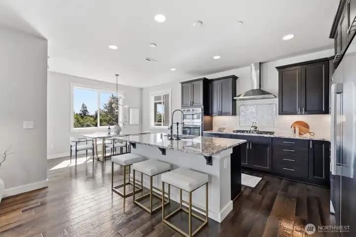 Gourmet kitchen with large island overlooking the main living area.