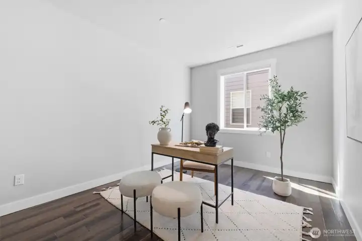 Flexible main-level room ideal for a home office or guest space.