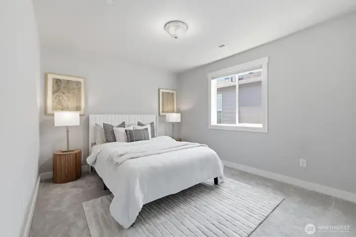 Comfortable secondary bedroom with ample closet space.