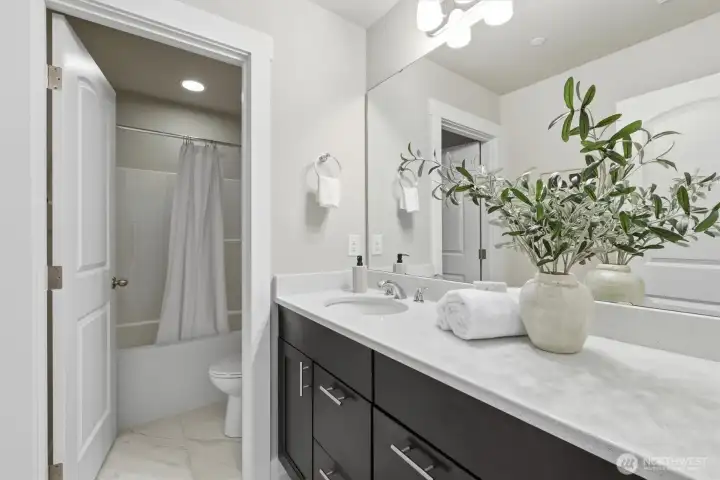 Well-appointed full bathroom with modern finishes.