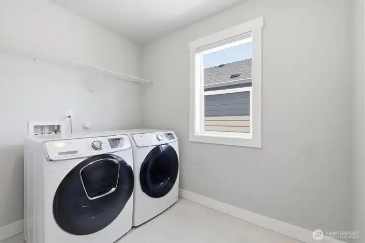 Convenient upstairs laundry room.