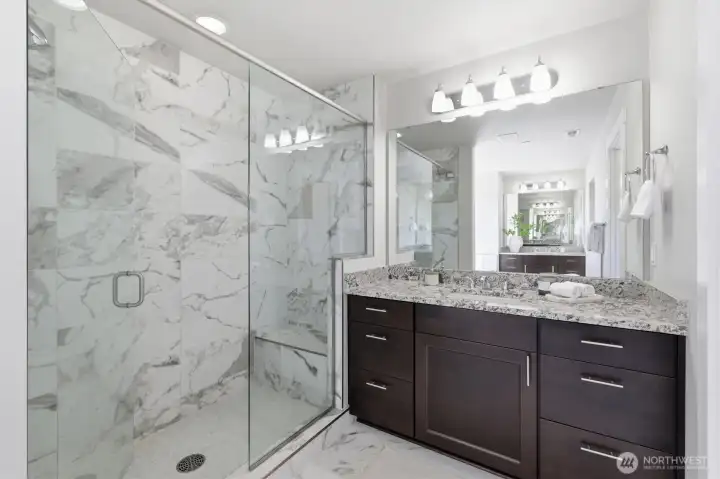 Spa-inspired walk-in shower with elegant tile surround.