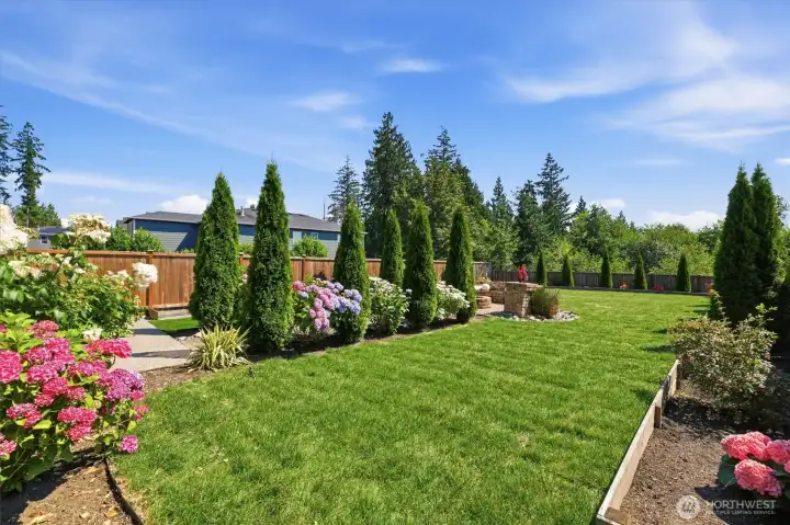 Spacious backyard offering room to relax, garden, or play.