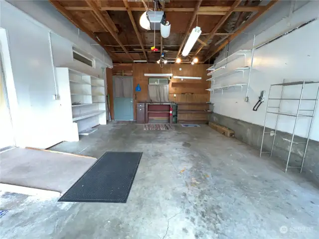 Garage with workbench and storage. Ramp for ease to enter your home.