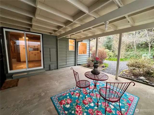 Experience the tranquility of nature as you listen to the soothing sound of raindrops or seek shelter from the sun under the expansive covered porch.