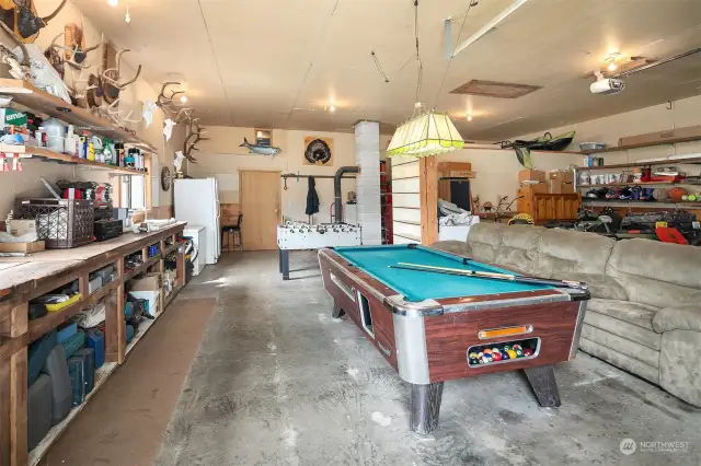 Inside of main shop. Tons of built in shelving for storage, extra enclosed storage rooms plus play room area! Pool table and other items negotiable!