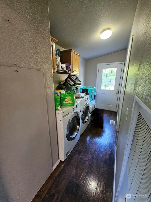 Laundry / utility room near back door.