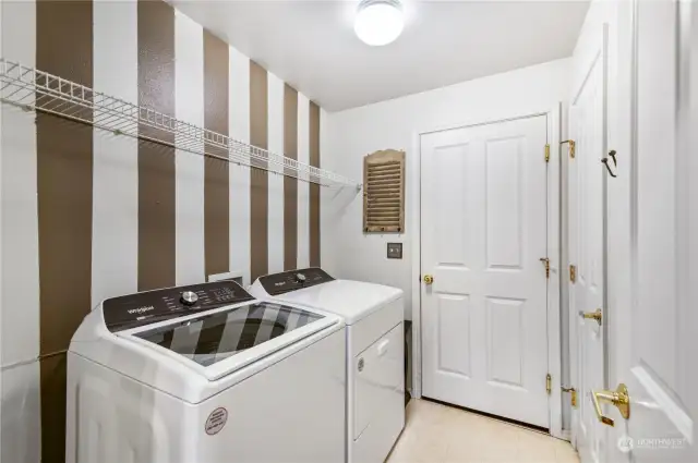 Laundry room with storage. All appliances stay with the home. New washer & dryer!