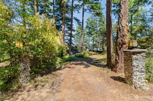 Stone pillars mark the entry to the property.