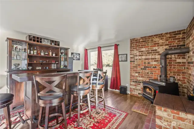 Family room off kitchen with bar.